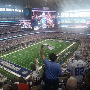Image of NFL game in progress at AT&T stadium in the United States