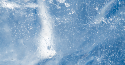 Image of block of clear blue ice taken from up close