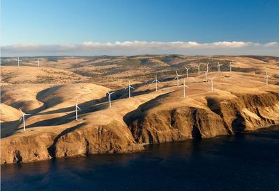 Image of a cliffside wind turbine farm on the coast of South Australia